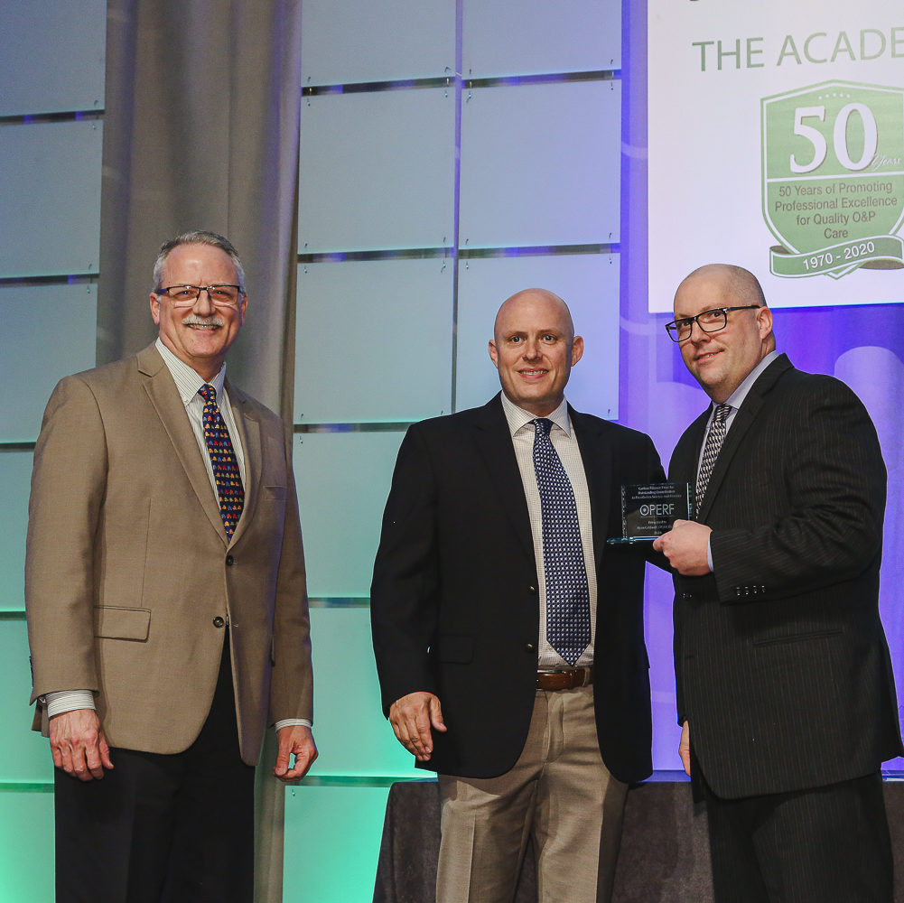 Michael Fillauer presents the Carlton Fillauer Prize to Ryan Caldwell